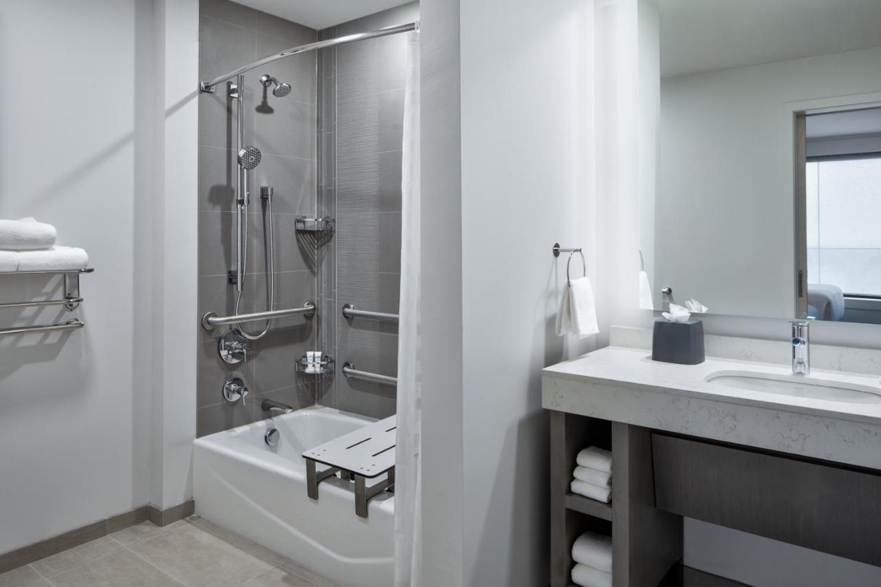 One-Bedroom King Suite Sofa Bed Kitchen Tub Disability Access