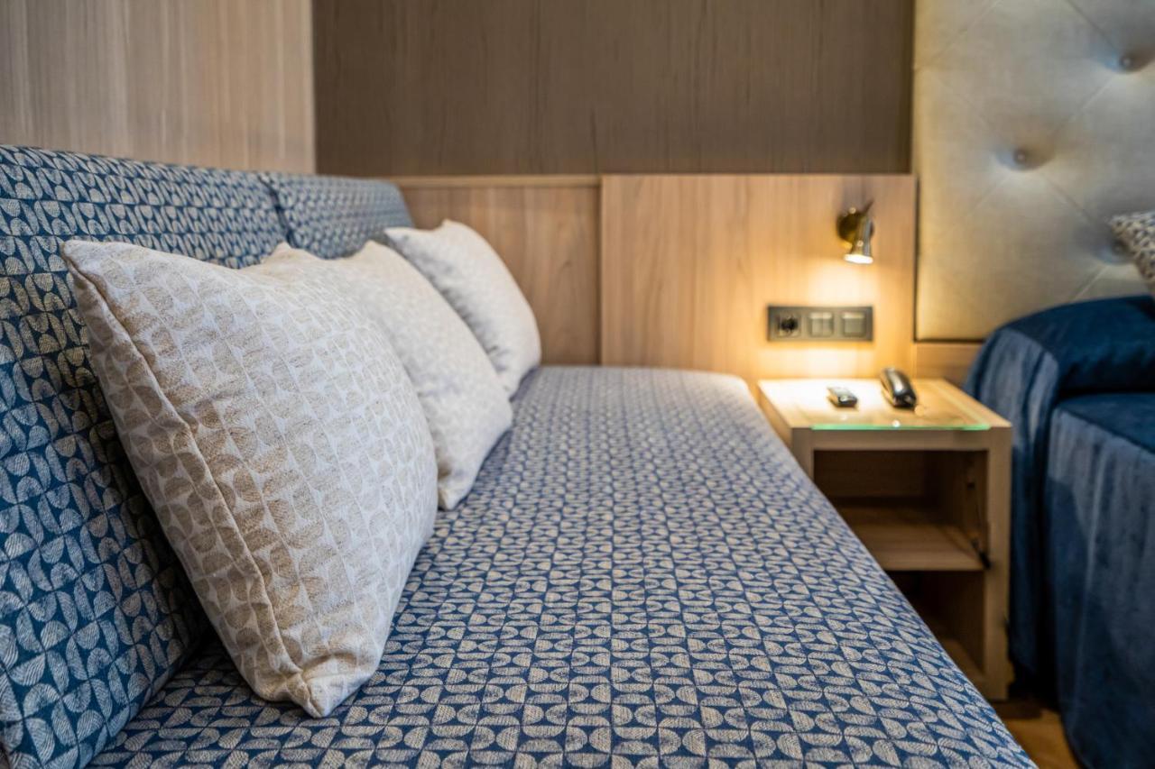 Camera Matrimoniale/Doppia con Letti Singoli con Letto Supplementare